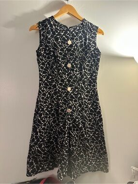 Sleeveless Black and White Patterned Dress with Button Front